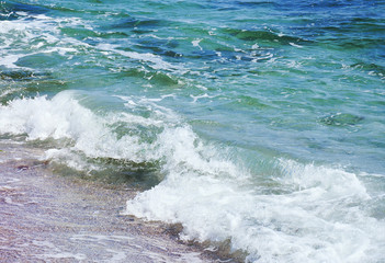 sea wave splashing on the beach shore