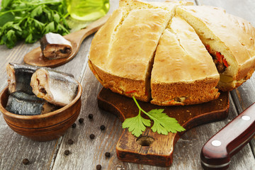 Pie with canned fish and vegetables
