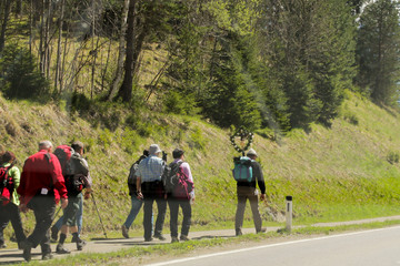 AUSTRIA, ERLAUFSEE, April 30, 2016: Pilgrims in the alps on the road