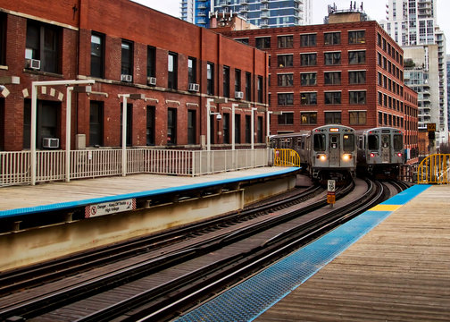 Transit system in Chicago - Two Elevated "el" trains entering and exiting the Wabash/Adams station.