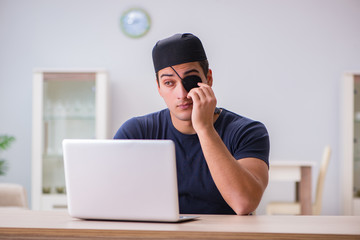 Digital security concept with pirate at computer