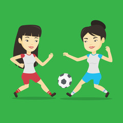 Two female soccer players fighting for ball.