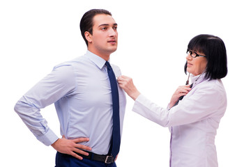 Experienced doctor examining young man isolated on white