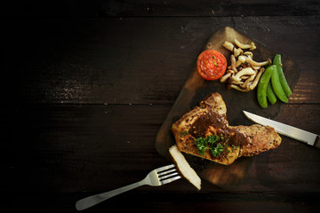 Kulobuta steak on the wood table.