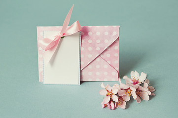 Blank thank you or greeting card and envelope And a spring flowering branch