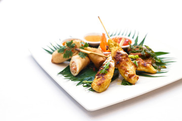 Chicken satay and fried fish-paste balls and Spring rolls