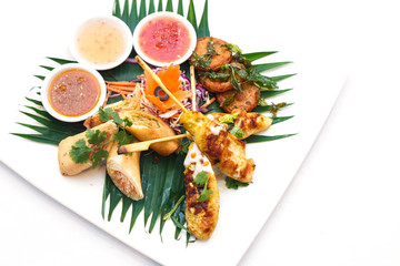 Chicken satay and fried fish-paste balls and Spring rolls