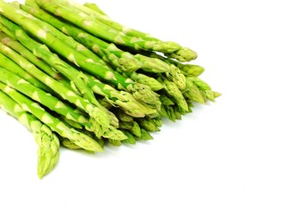 green raw asparagus isolated on white background