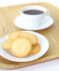 Mini coconut biscuit and a cup of coffee