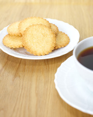 Mini coconut biscuit and a cup of coffee