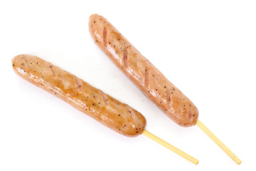 Delicious Hot sausage with wood skewer on white background