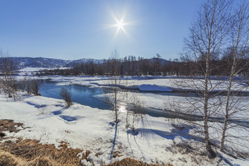 Katun River flowing near the mountains in early spring