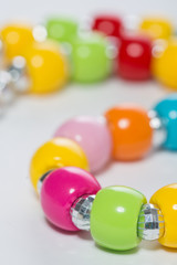 Multicolored beads on a white
