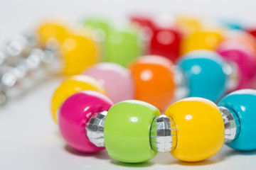 Multicolored beads on a white