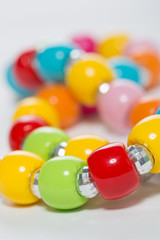 Multicolored beads on a white