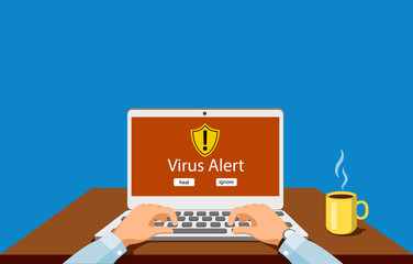 Person at the computer Virus notification concept of virus protection.