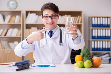 Doctor in dieting concept with fruits and vegetables