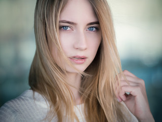 Portrait of a beautiful young woman with blue eyes.