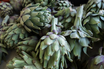 Obraz premium big ripe artichokes for sale at local market