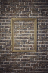 Empty frame on a wall brick