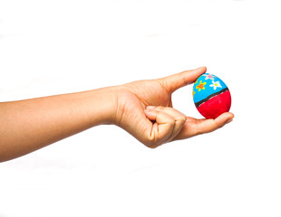 hand holding a easter egg on white