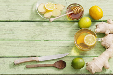  Ginger tea and ingredients on a  grunge wooden background