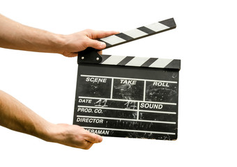 Obraz premium Hands with a movie clapperboard isolated on white background