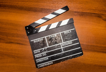 Movie clapper on the wood table 