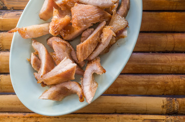 grilled pork neck on bamboo table
