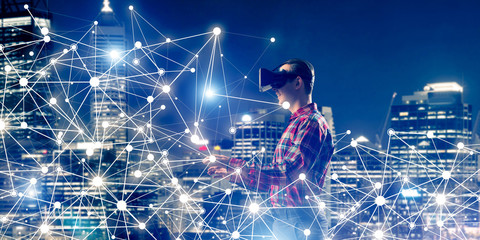 Guy wearing checked shirt and virtual mask reaching hand to feel