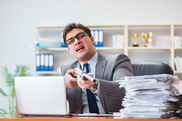 Angry aggressive businessman in the office