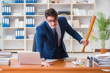 Angry aggressive businessman in the office