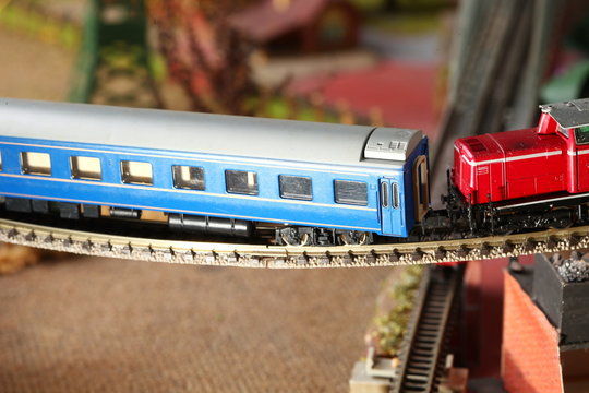 Model railroad on the miniature model scenery represent the transportation and model toy train concept related idea.