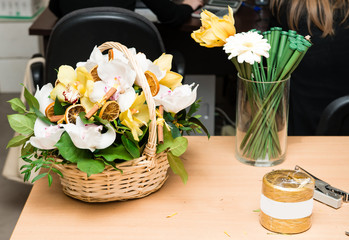basket of fresh orchid flowers on the table