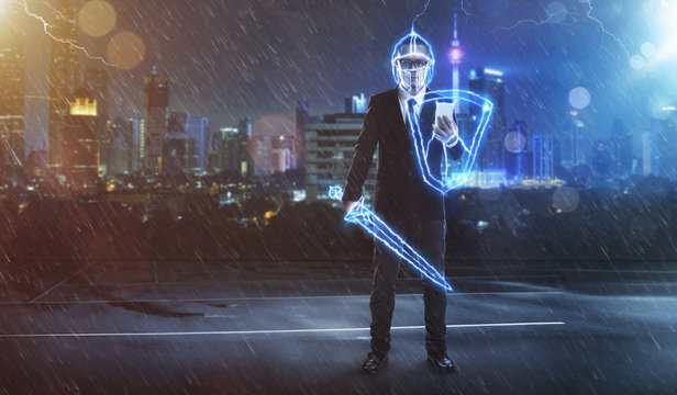 Businessman turned into thunder warrior,holding a lightning sword and shield ,preparation, protection, precaution and security in business concept .