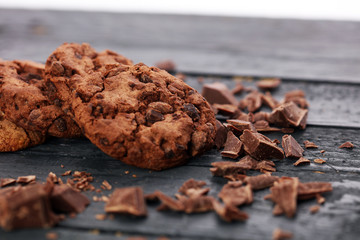 Chocolate cookies on wooden table. Chocolate chip cookies shot