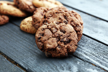 Chocolate cookies on wooden table. Chocolate chip cookies shot