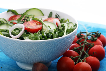 Bowl of salad on wooden table