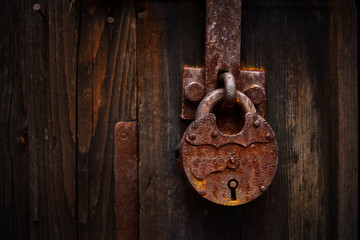 Vintage padlock close-up on wooden door