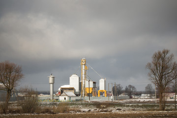 Small factory in a village in early spring