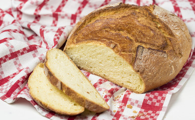 Selective focus on baked bread isolated on red and white canvas