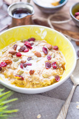 Oatmeal Bowl with Raisins, Nuts and Banana for Healthy Vegan Breakfast, Perfect Healthy Breakfast