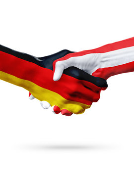 Flags Germany, Austria countries, partnership friendship handshake concept.