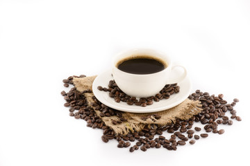 Coffee cup with beans on hemp sack