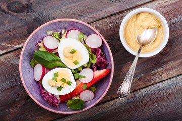 Healthy salad with eggs and vegetables