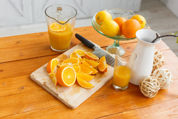 sliced oranges on a wooden cutting board. Healthy and tasty breakfast