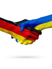 Flags Germany, Ukraine countries, partnership friendship handshake concept.