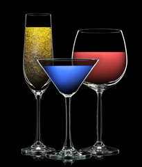 Set of multicolor different drinks in various glasses on black background