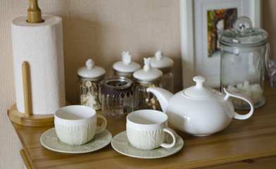 Set of new white dishes on wooden table, indoors