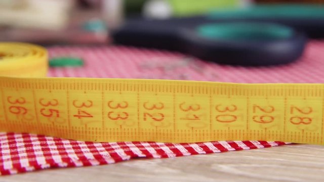 centimeter measuring tape and scissors on the fabric
